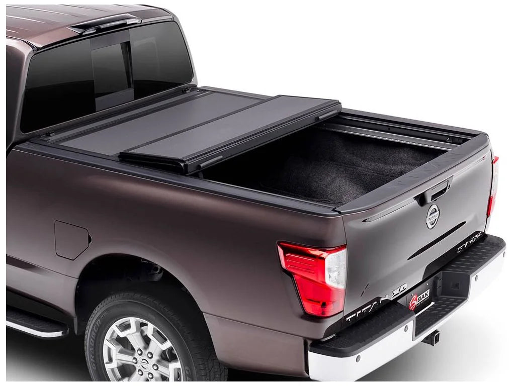 BAK by RealTruck BAKFlip MX4 Hard Folding Truck Bed Tonneau protector | 448525 | matching with 2017 - 2023 Nissan Titan 5' 7" Bed (67")