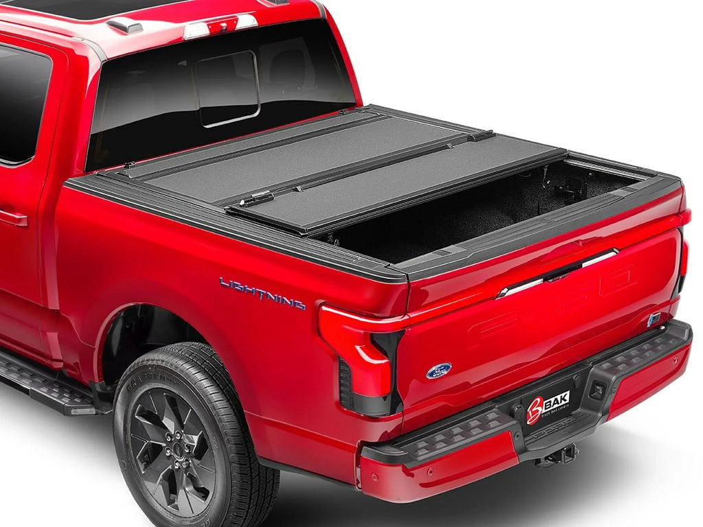 BAK by RealTruck BAKFlip MX4 Hard Folding Truck Bed Tonneau protector | 448525 | matching with 2017 - 2023 Nissan Titan 5' 7" Bed (67")