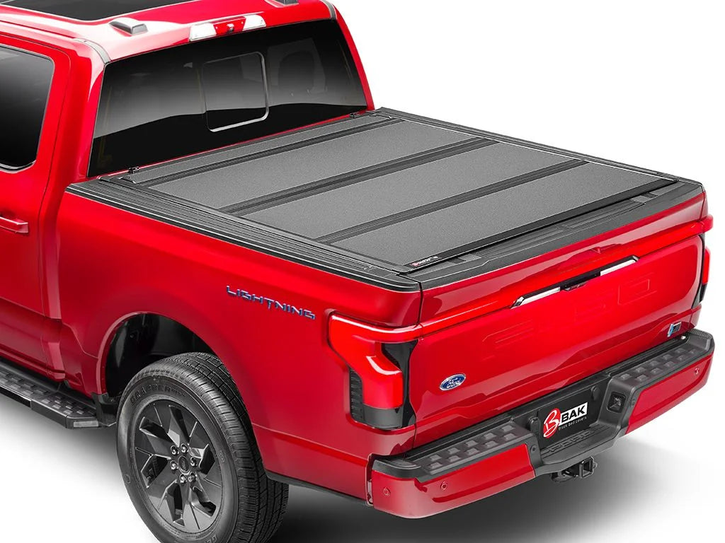 BAK by RealTruck BAKFlip MX4 Hard Folding Truck Bed Tonneau protector | 448525 | matching with 2017 - 2023 Nissan Titan 5' 7" Bed (67")