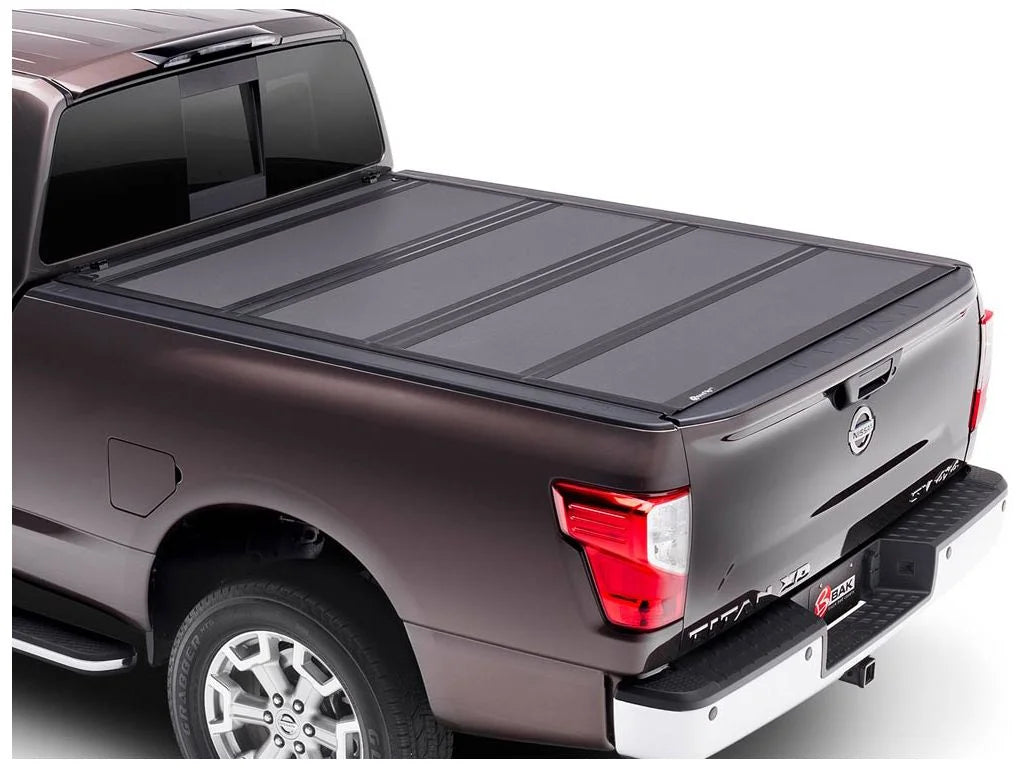 BAK by RealTruck BAKFlip MX4 Hard Folding Truck Bed Tonneau protector | 448525 | matching with 2017 - 2023 Nissan Titan 5' 7" Bed (67")