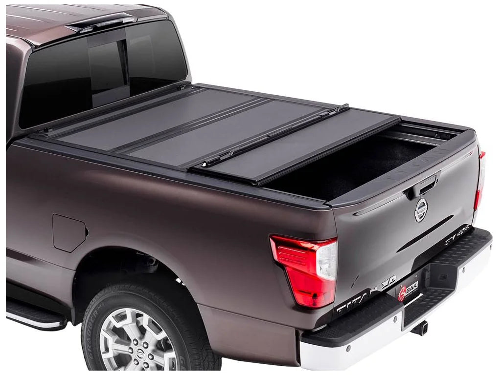 BAK by RealTruck BAKFlip MX4 Hard Folding Truck Bed Tonneau protector | 448525 | matching with 2017 - 2023 Nissan Titan 5' 7" Bed (67")