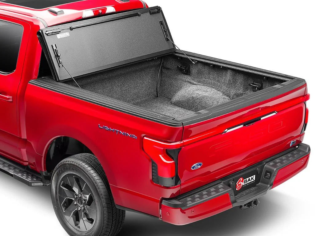 BAK by RealTruck BAKFlip MX4 Hard Folding Truck Bed Tonneau protector | 448525 | matching with 2017 - 2023 Nissan Titan 5' 7" Bed (67")